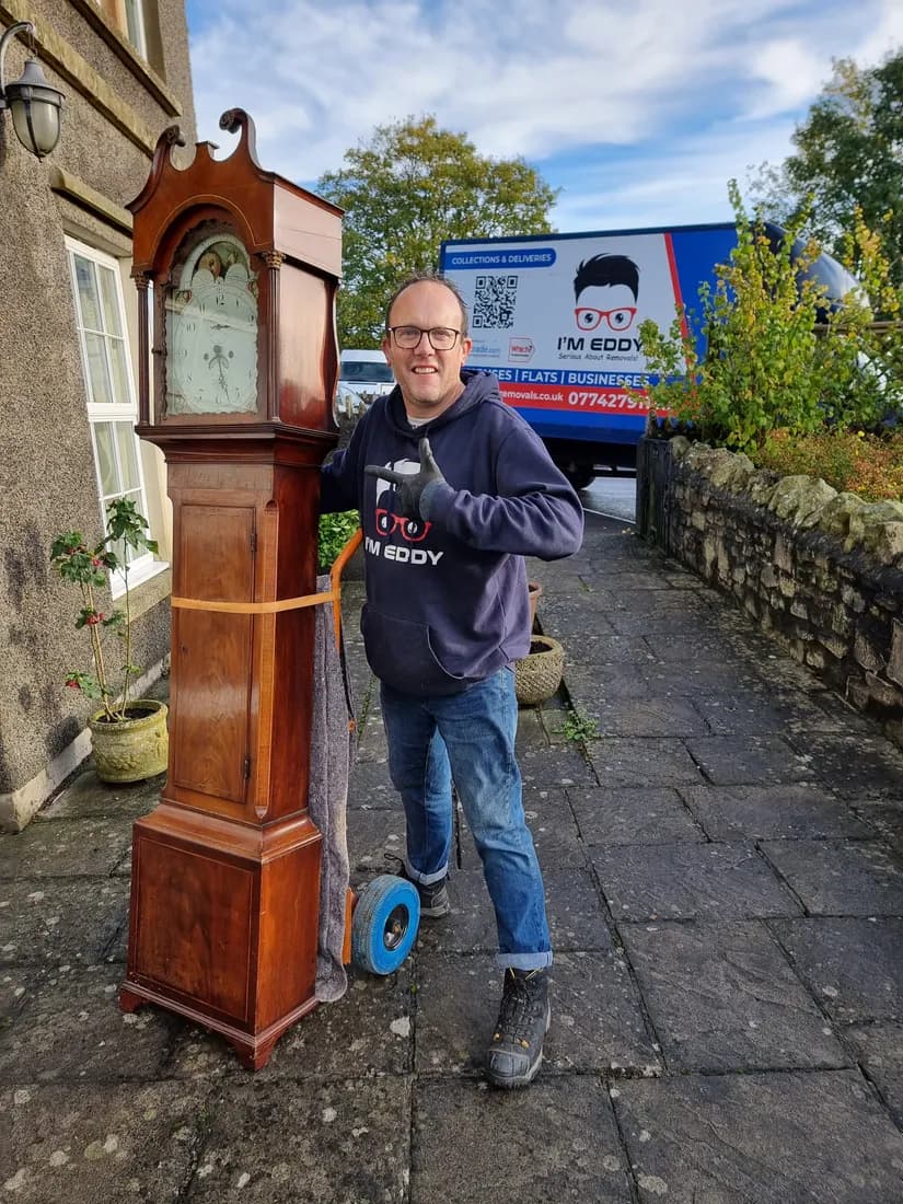 Moving an antique grandfather clock on the sack truck